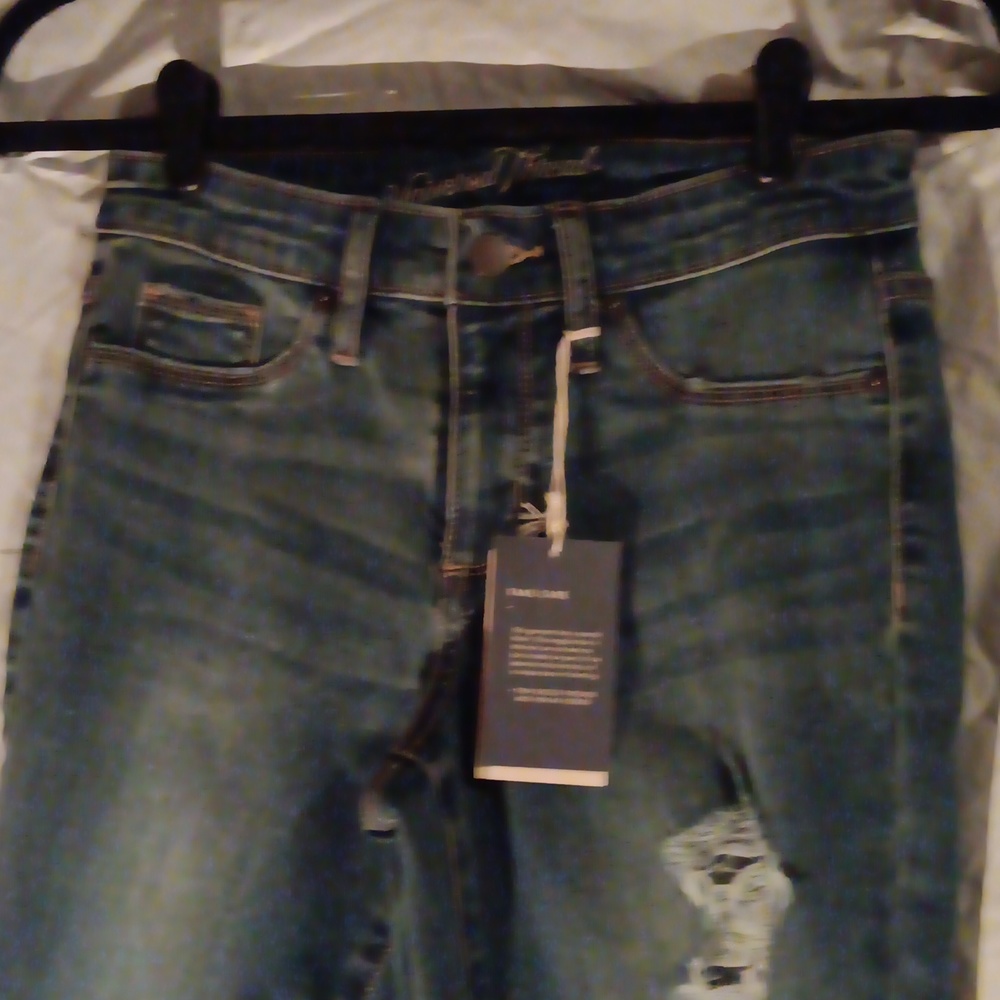 Nwt high rise jegging with rips and ripped ankles at bottom